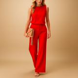 Elegant wide-leg jumpsuit for women with round neckline and refined silhouette, perfect for work, parties, and special occasions.