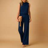 Elegant wide-leg jumpsuit for women with round neckline and refined silhouette, perfect for work, parties, and special occasions.