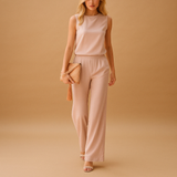 Elegant wide-leg jumpsuit for women with round neckline and refined silhouette, perfect for work, parties, and special occasions.