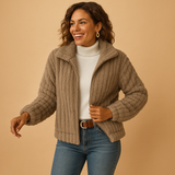 Long fleece jacket for women with stand collar, practical pockets, and cozy fit, available in beige, gray, black, and blue.