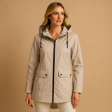 Long waterproof raincoat for women with hood and breathable fabric, available in apricot, blue, coffee, gray, white, and wine red.