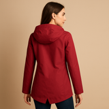 Long waterproof raincoat for women with hood and breathable fabric, available in apricot, blue, coffee, gray, white, and wine red.