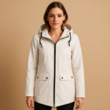 Long waterproof raincoat for women with hood and breathable fabric, available in apricot, blue, coffee, gray, white, and wine red.