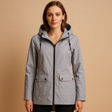 Long waterproof raincoat for women with hood and breathable fabric, available in apricot, blue, coffee, gray, white, and wine red.