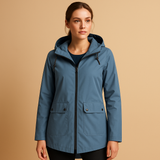 Long waterproof raincoat for women with hood and breathable fabric, available in apricot, blue, coffee, gray, white, and wine red.