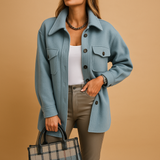 Waterproof windproof jacket for women with fold-over collar, button closure, and pockets. Available in multiple colors, perfect for work or casual wear.